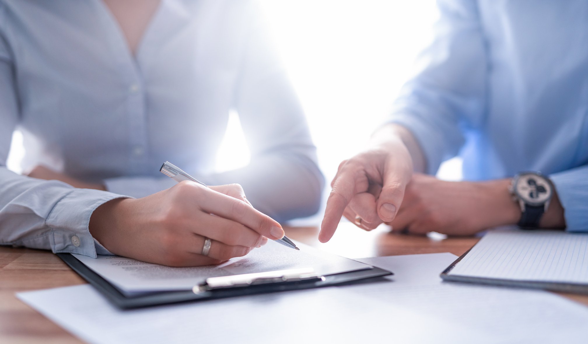 Business People Negotiating a Contract Photo